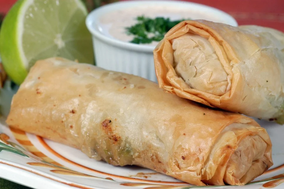 Crispy spring rolls served with dipping sauce