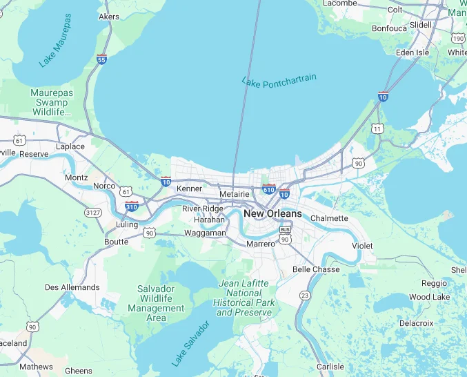 A detailed map showing the city layout of New Orleans, including road routes and surrounding bodies of water.