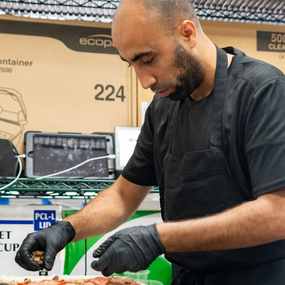 A restaurant chef preparing a dish