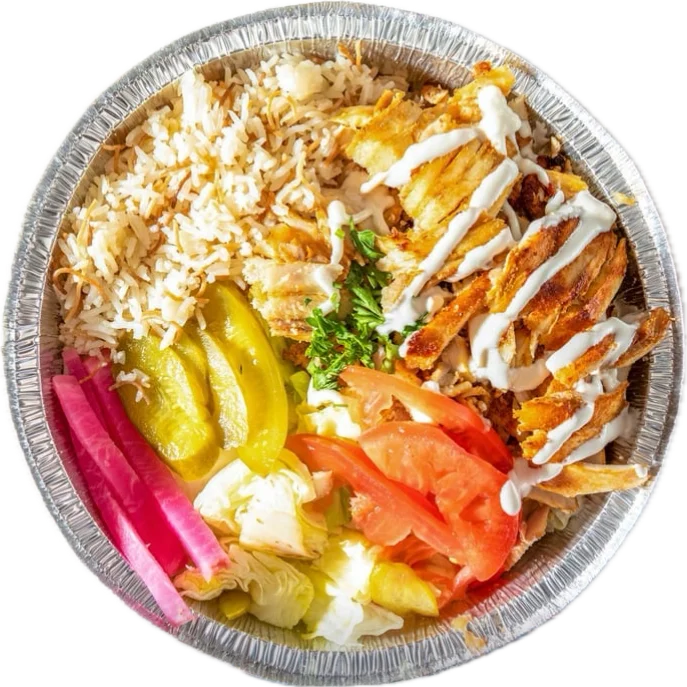 Middle Eastern chicken shawarma platter with rice and fresh vegetables