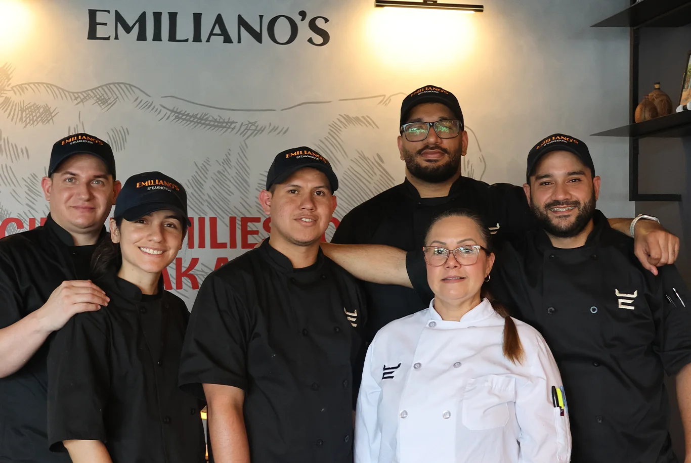 Culinary team at Emiliano's restaurant posing together