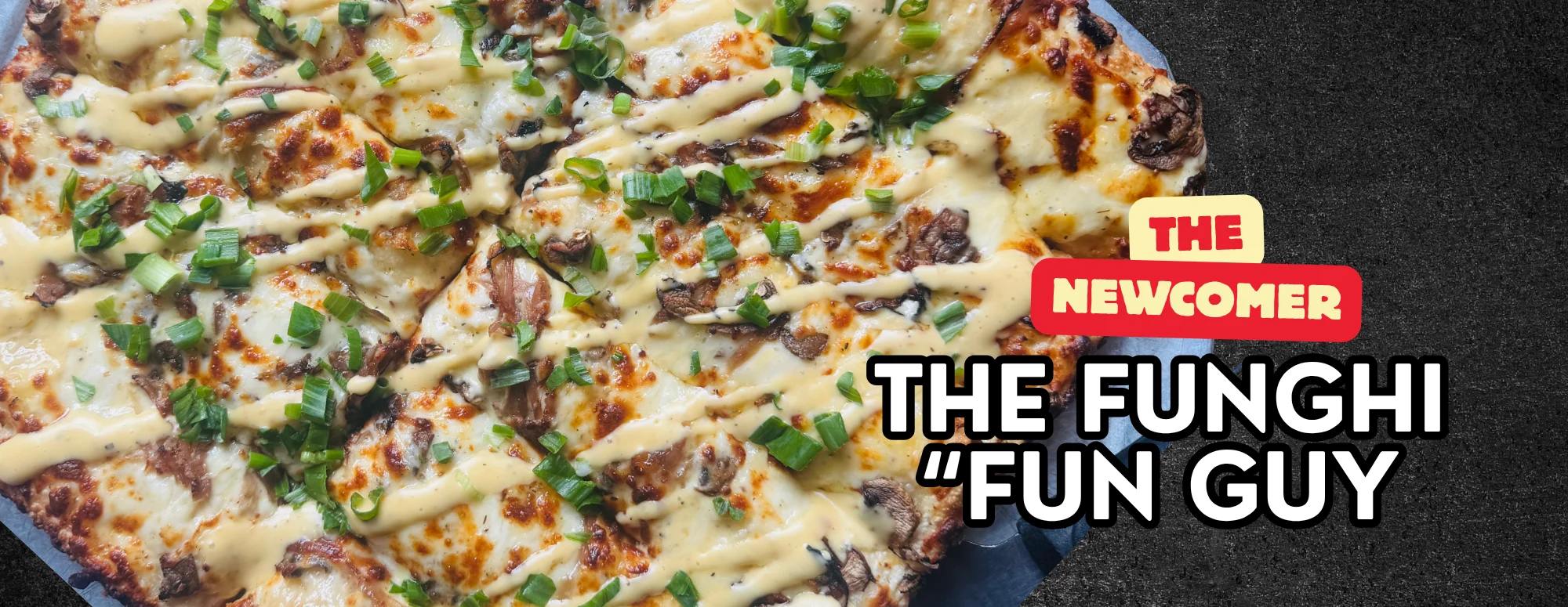 Gourmet pizza topped with mushrooms and drizzled sauce