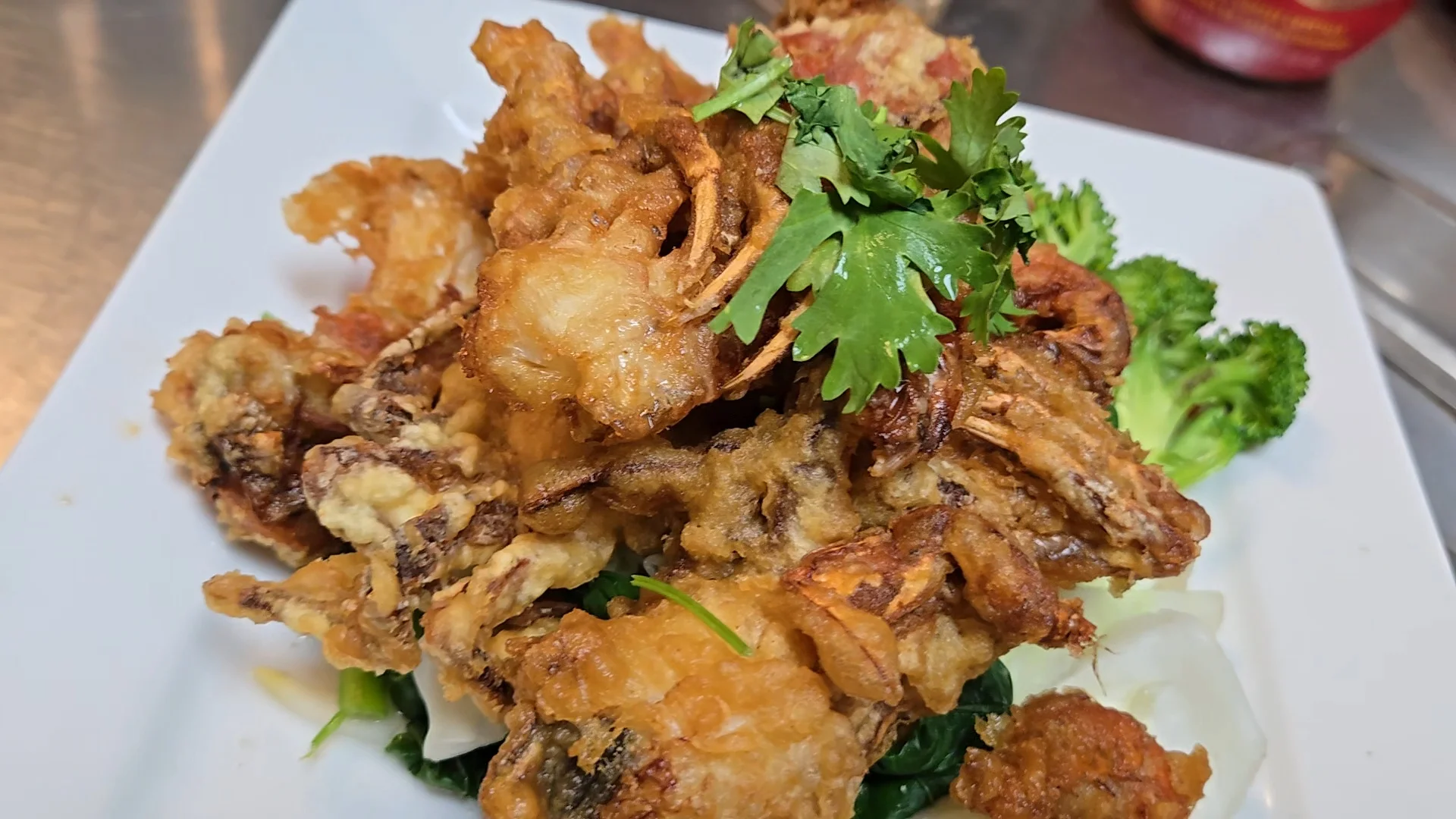 Crispy fried soft shell crab dish with herbs
