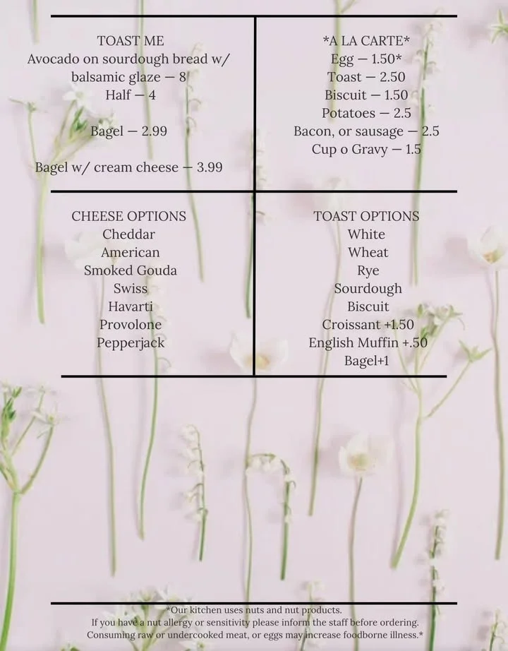 A menu featuring various breakfast items including toast, drinks, and breakfast platters on a floral background.
