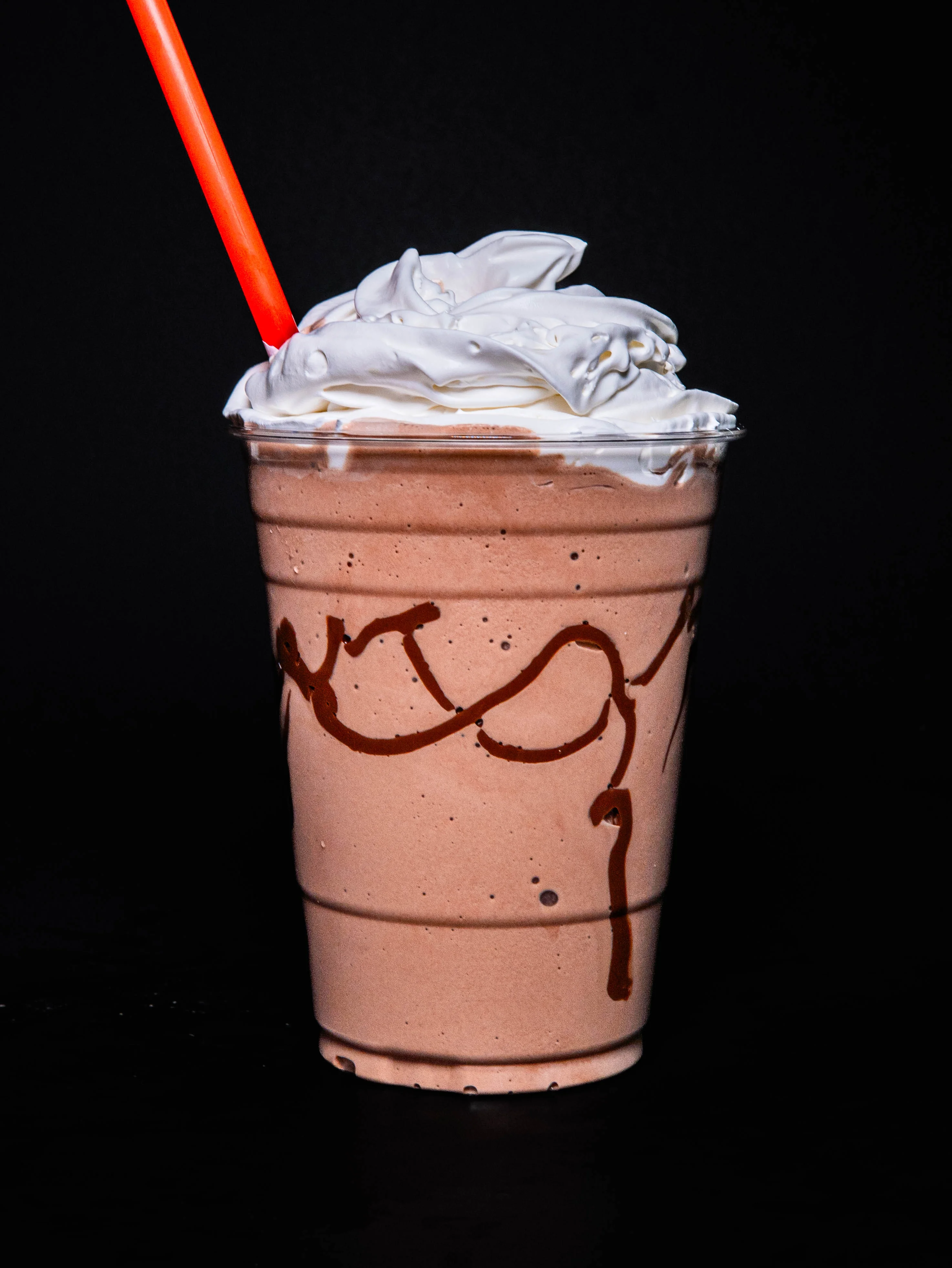 Chocolate milkshake topped with whipped cream