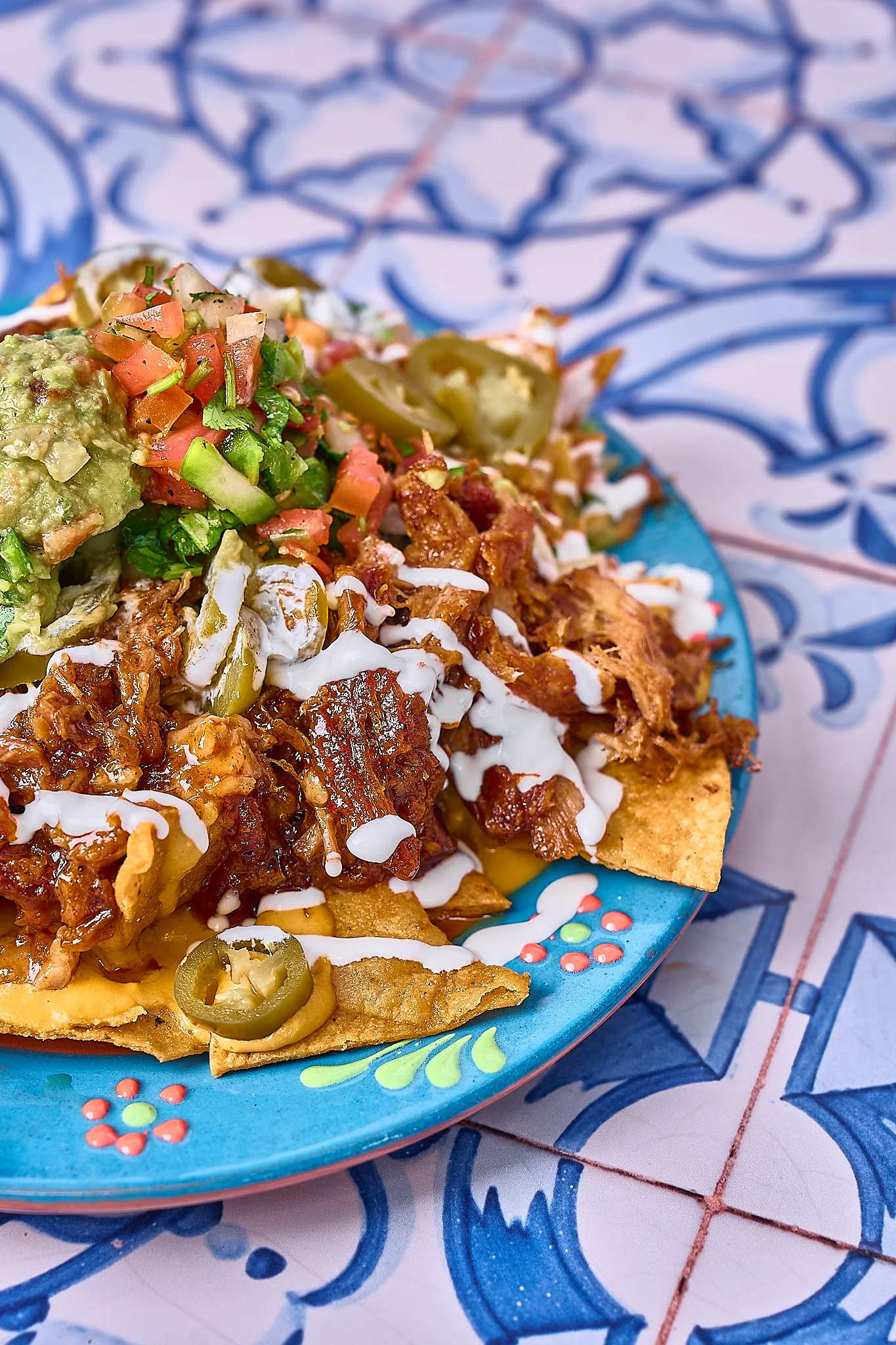 Loaded nachos with pulled pork and toppings