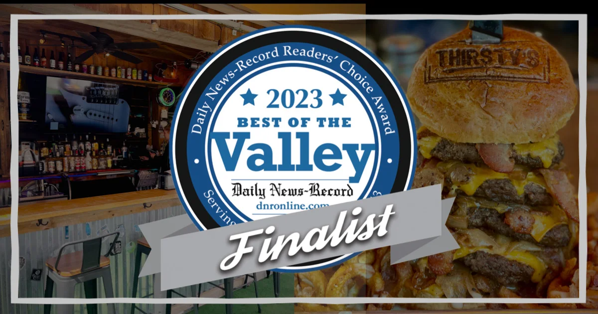 Award-winning burger at a lively bar setting