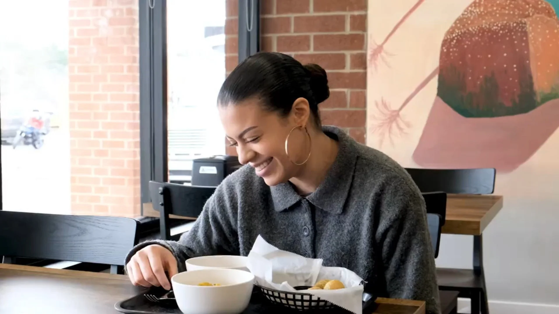 Smiling diner enjoying a cozy meal in a modern restaurant