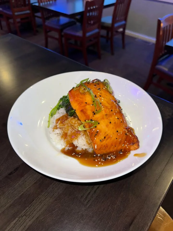 Grilled teriyaki salmon on rice with vegetables