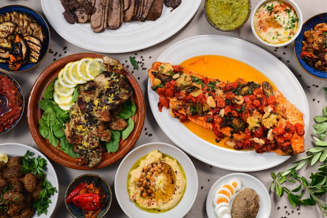 Mediterranean grilled salmon with vegetables and sides