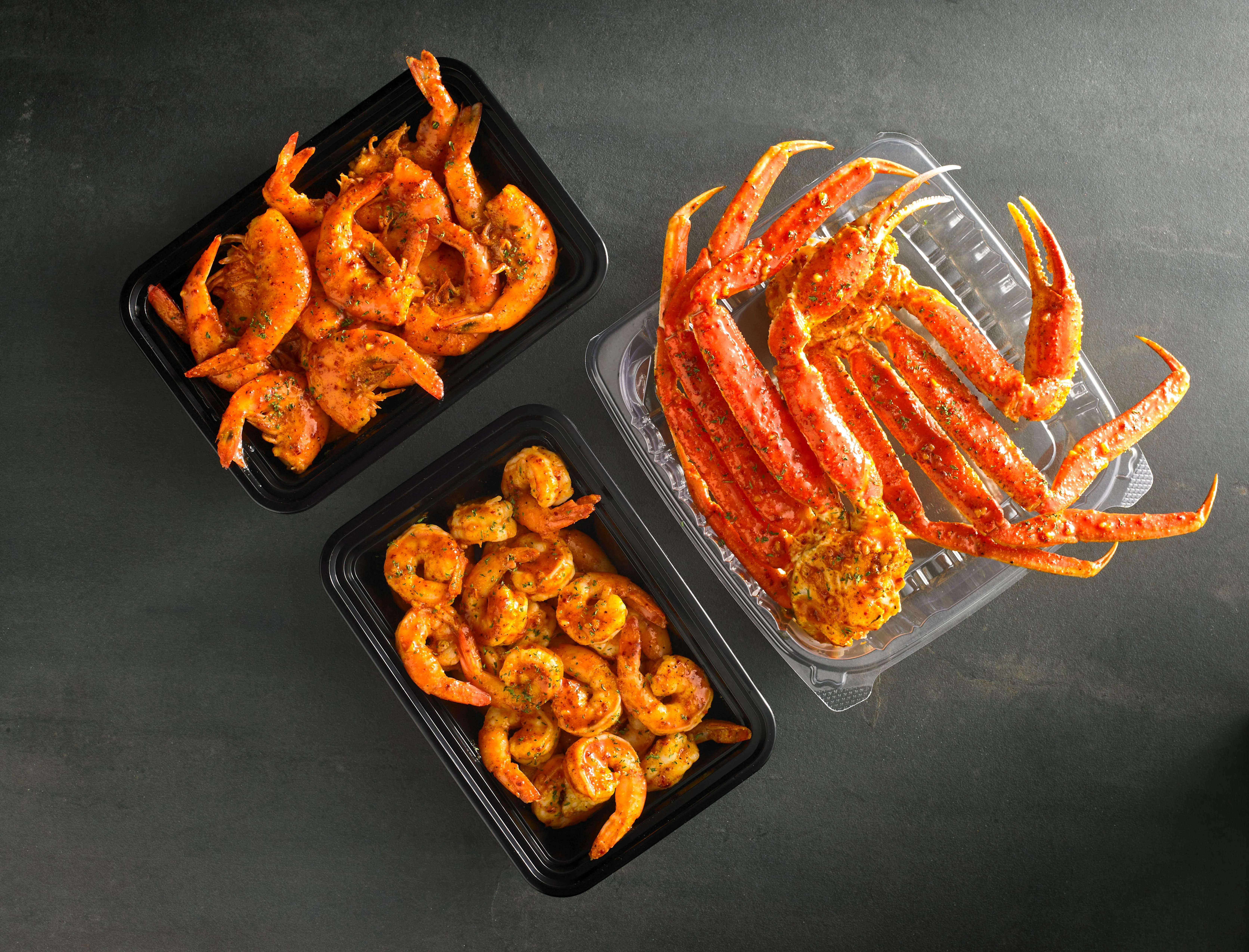 Seafood boil platter with crab, shrimp, and corn