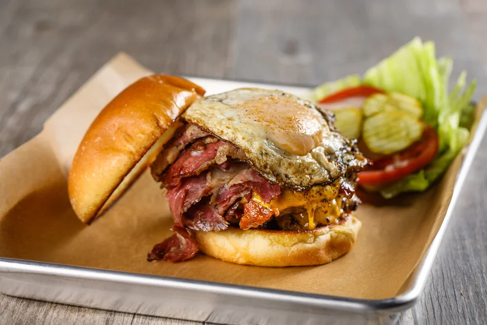 Hearty American breakfast burger with egg