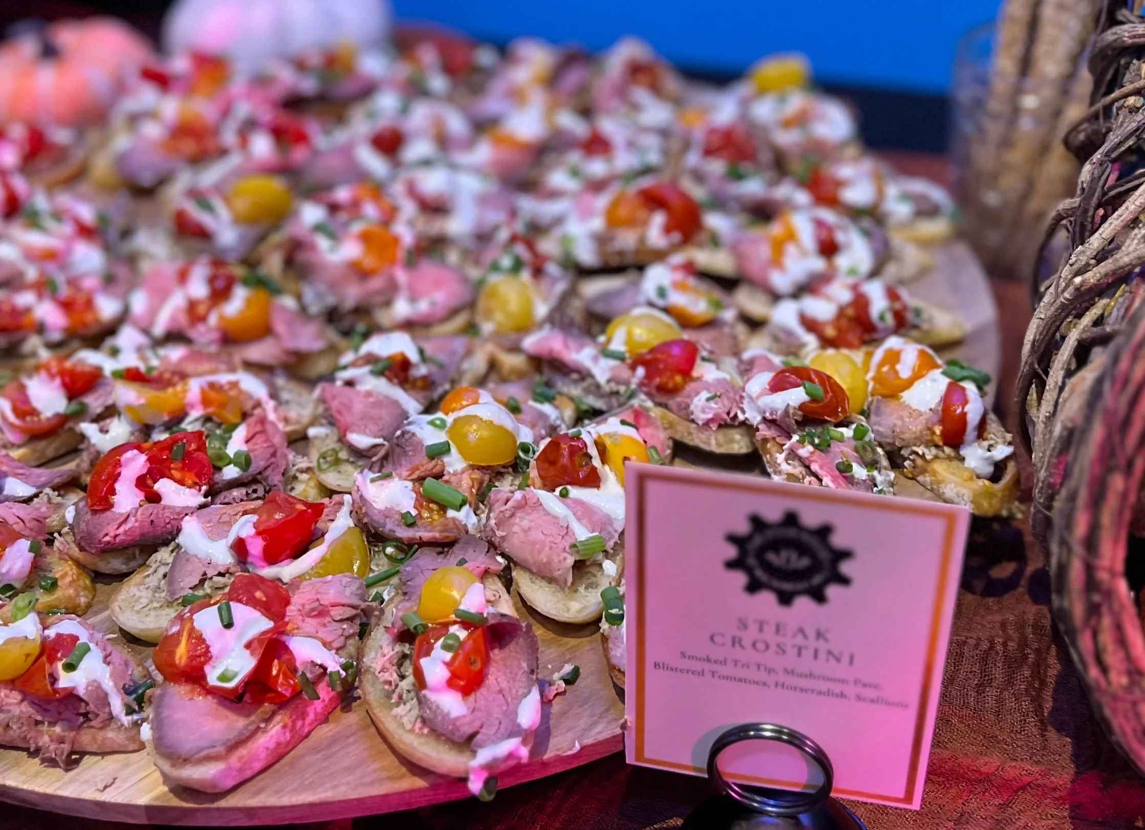 Steak crostini platter with colorful toppings