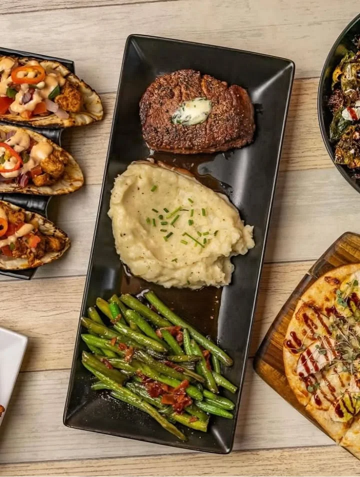 Classic American steak dinner with mashed potatoes and green beans