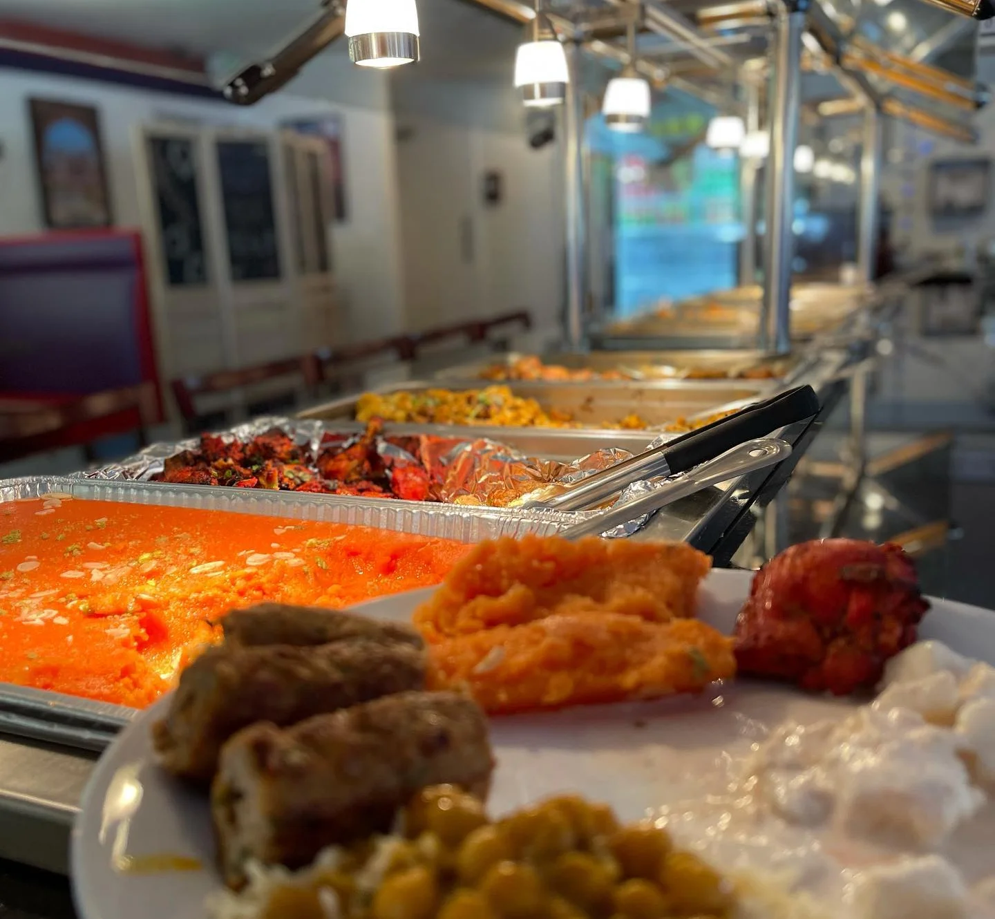 Delicious kababs served on a platter with fresh vegetables.