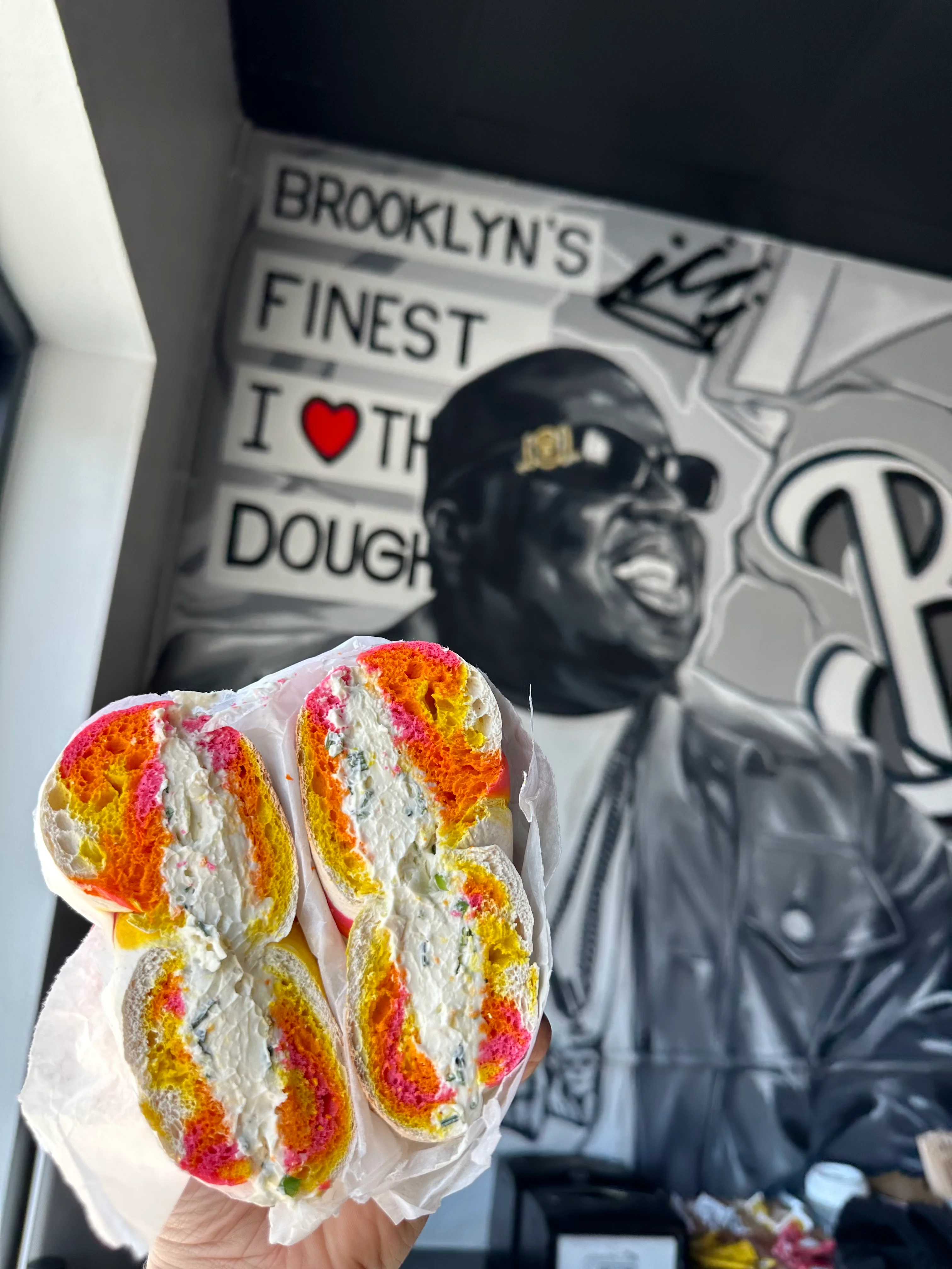 Colorful Brooklyn-style bagel with cream cheese filling