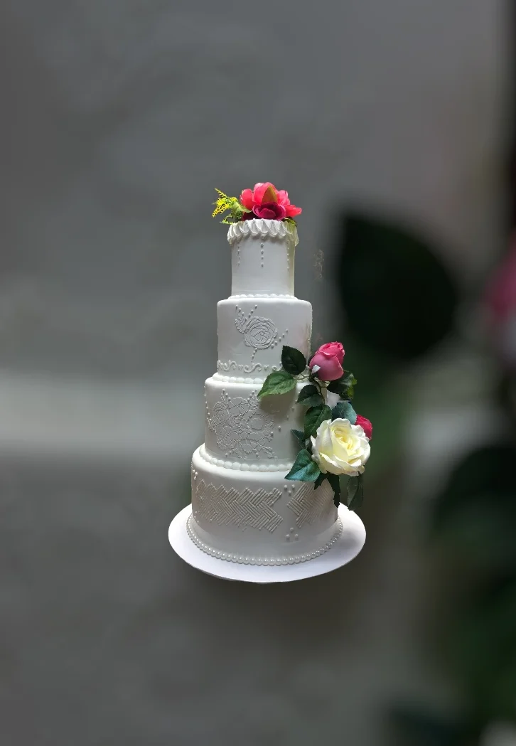 Elegant wedding cake adorned with flowers
