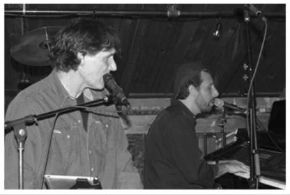 Musicians performing live at a cozy venue