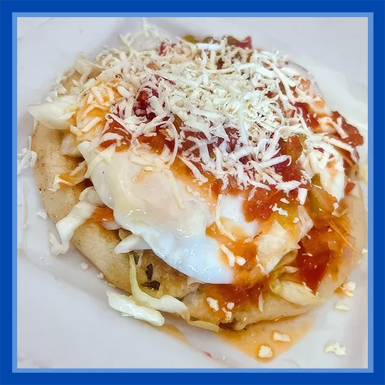 Huevos rancheros served on a tortilla with salsa