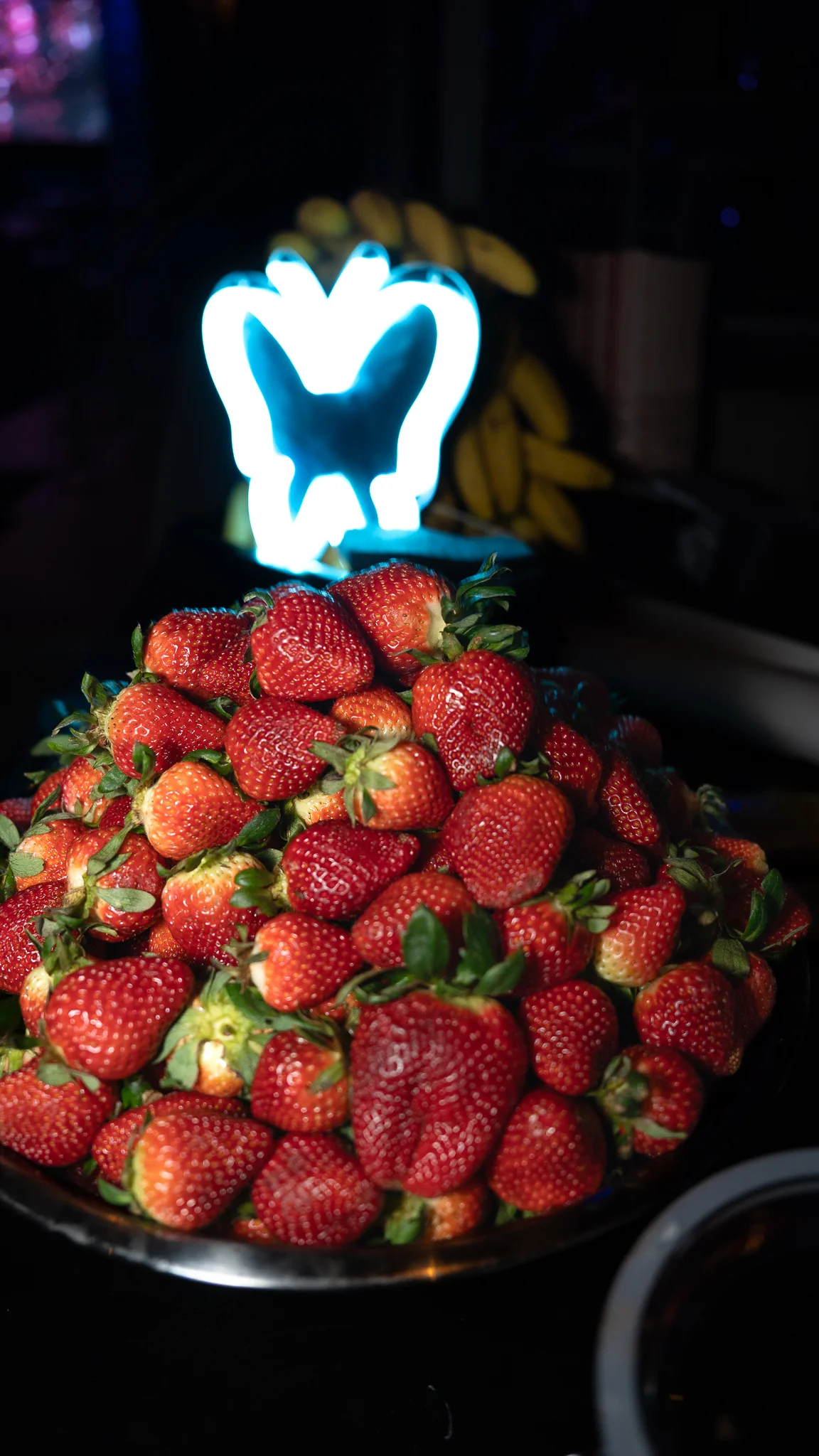 Fresh strawberries piled high on a serving platter
