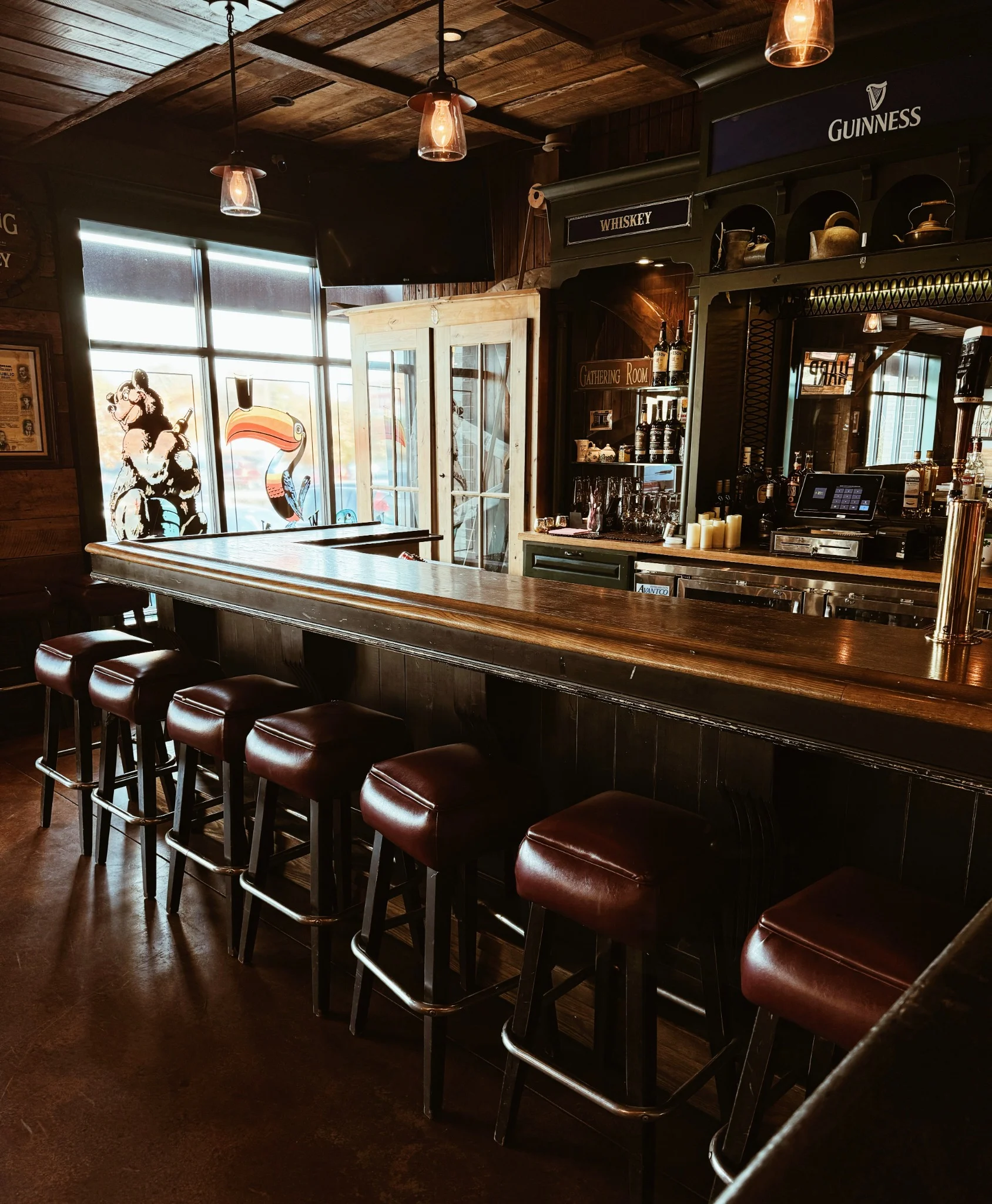Warm wood bar and leather bar stools at Mystic Rogue Irish Pub