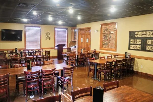 Cozy restaurant interior with wooden tables and warm lighting