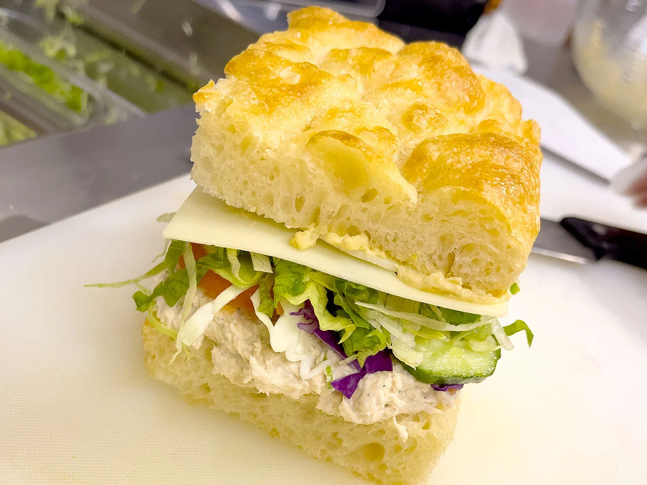 Freshly made Italian focaccia sandwich with tuna and vegetables