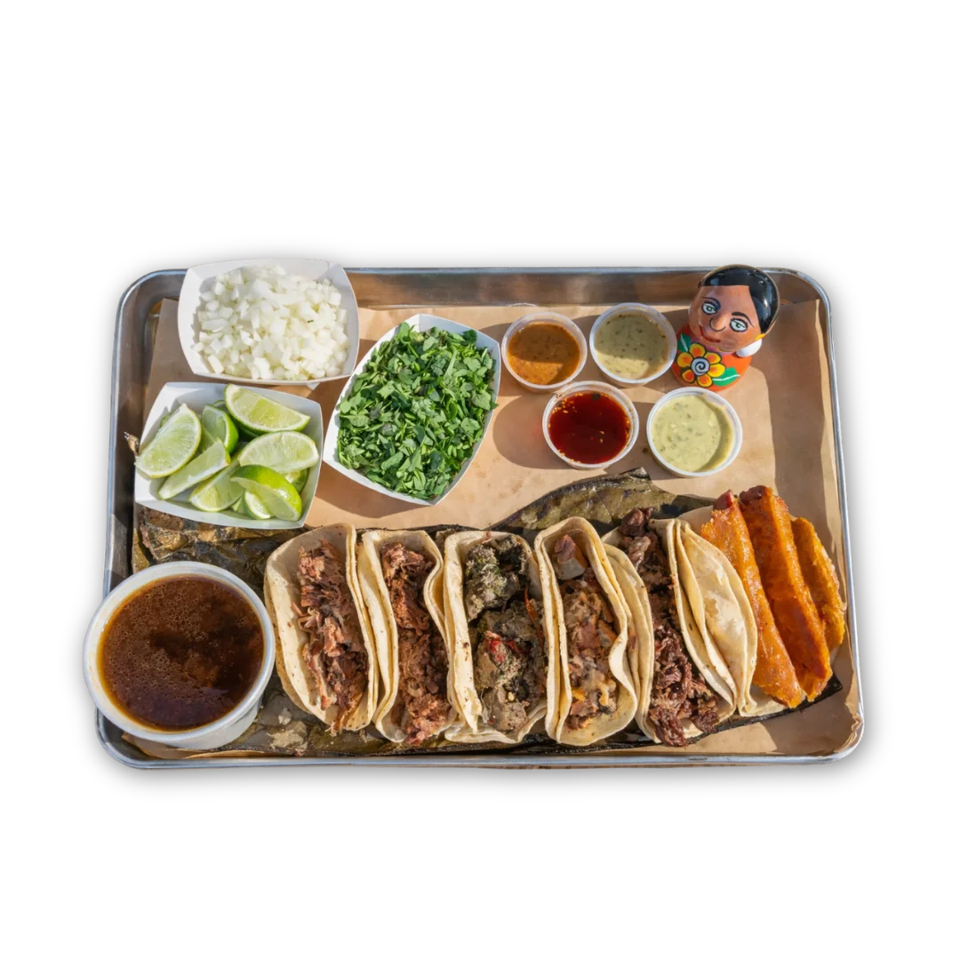 Authentic Mexican tacos served with various salsas and garnishes
