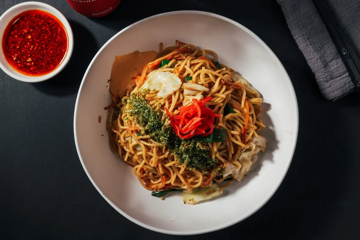 A delicious plate of Yakisoba noodles with vegetables and meat.