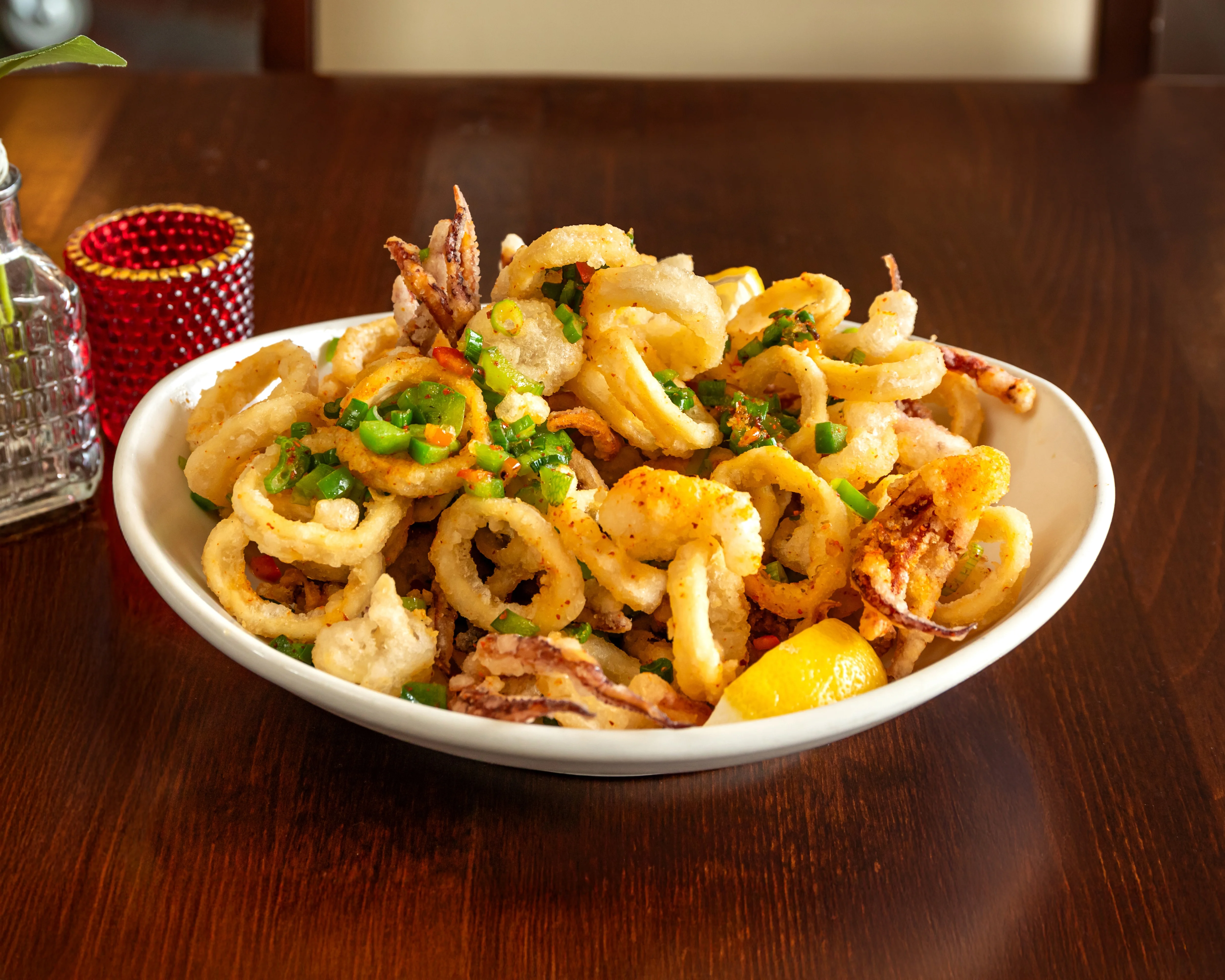 Crispy calamari served with lemon and green onions