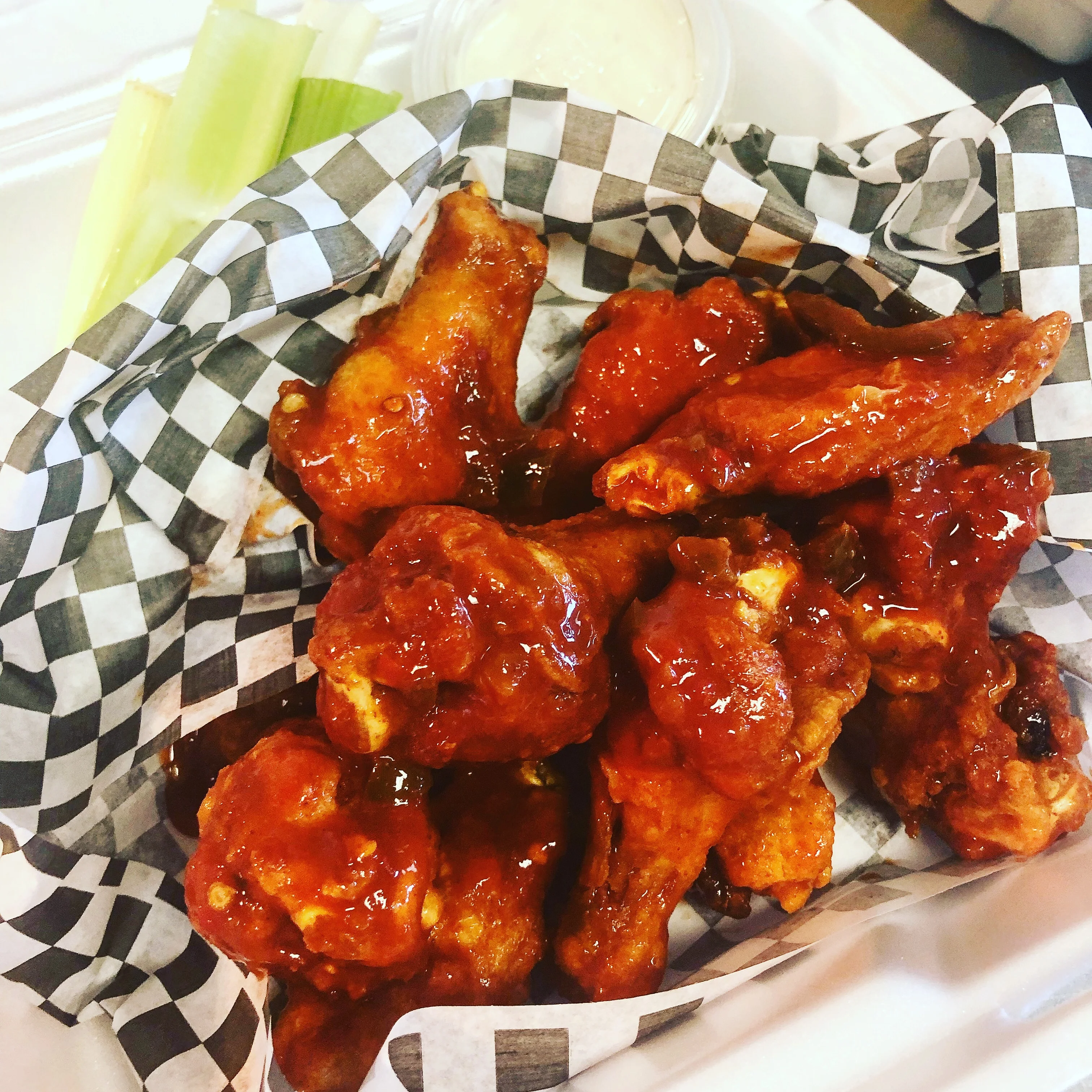 Spicy buffalo chicken wings with celery and ranch dressing