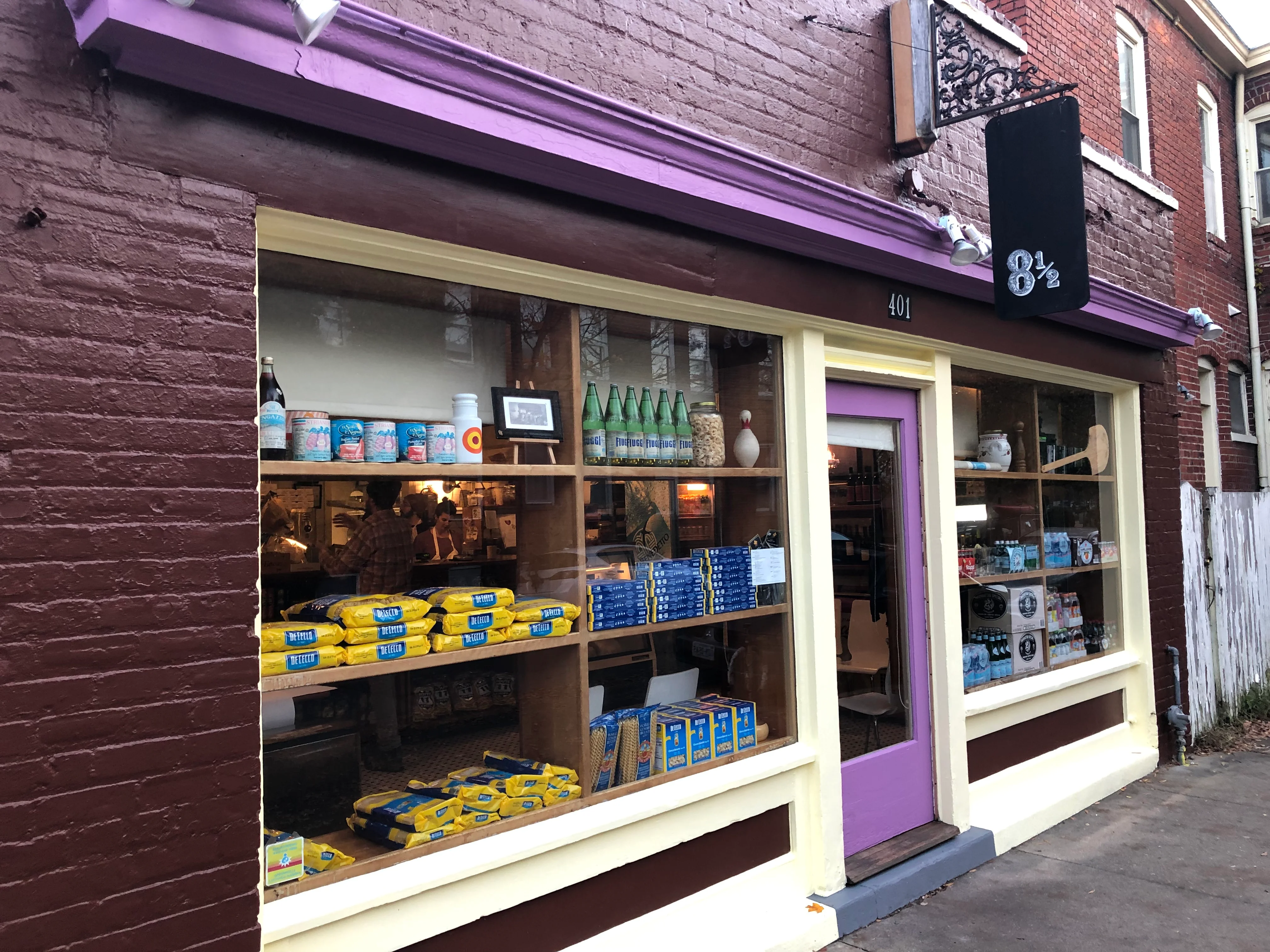Charming storefront of a cozy restaurant with purple accents
