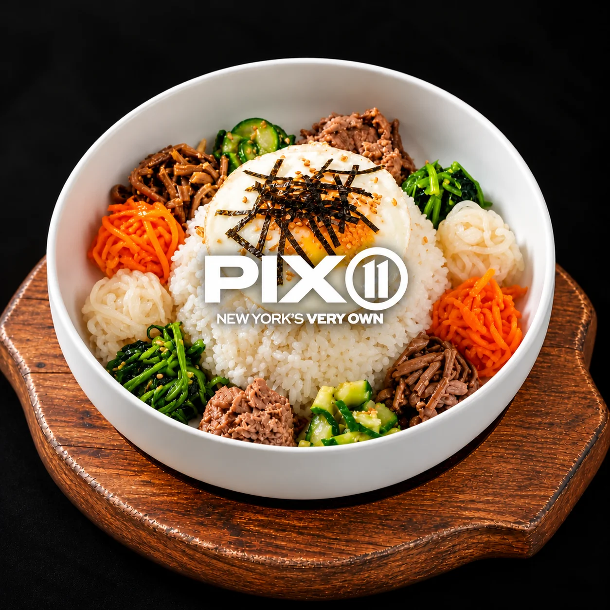Korean bibimbap with fried egg and colorful vegetables