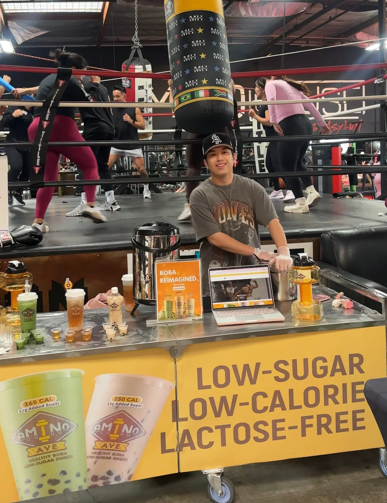 Boba tea stand at a boxing gym promoting low-sugar drinks