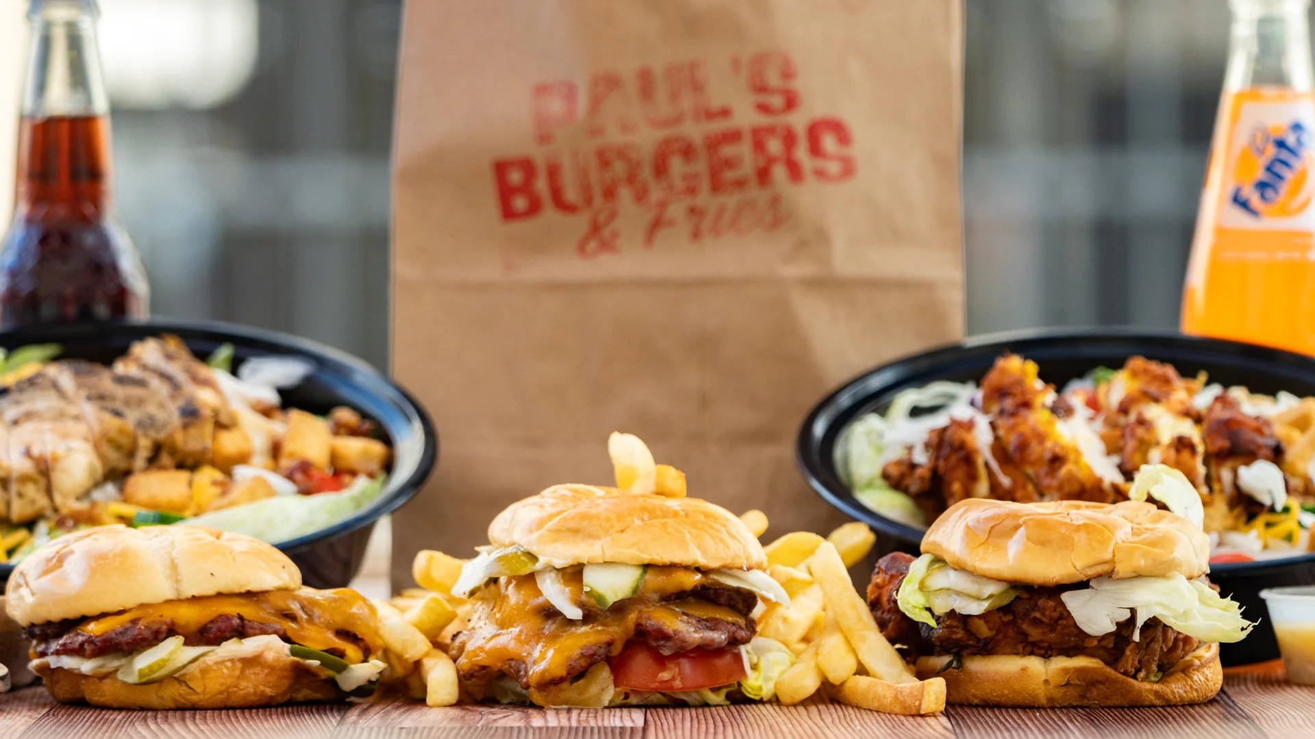 Delicious American burgers with fries and a side salad
