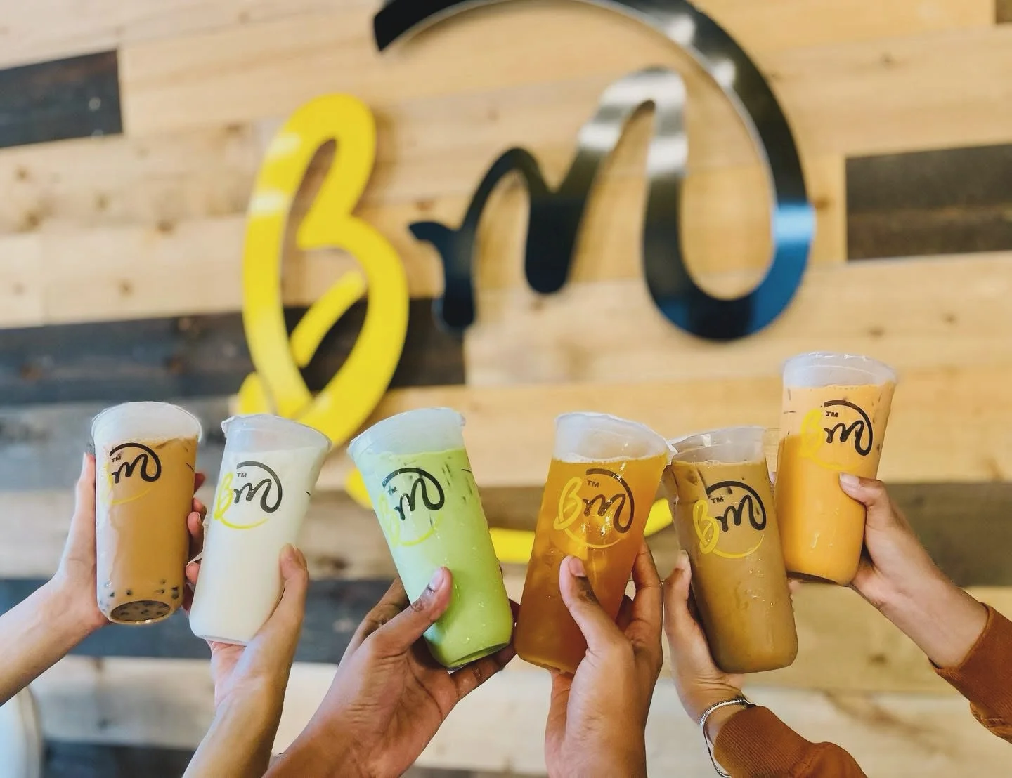 Colorful bubble tea drinks in a cozy café setting