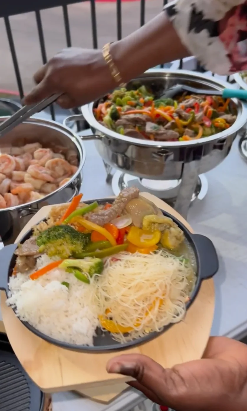 Colorful stir-fried Asian rice bowl with shrimp and vegetables
