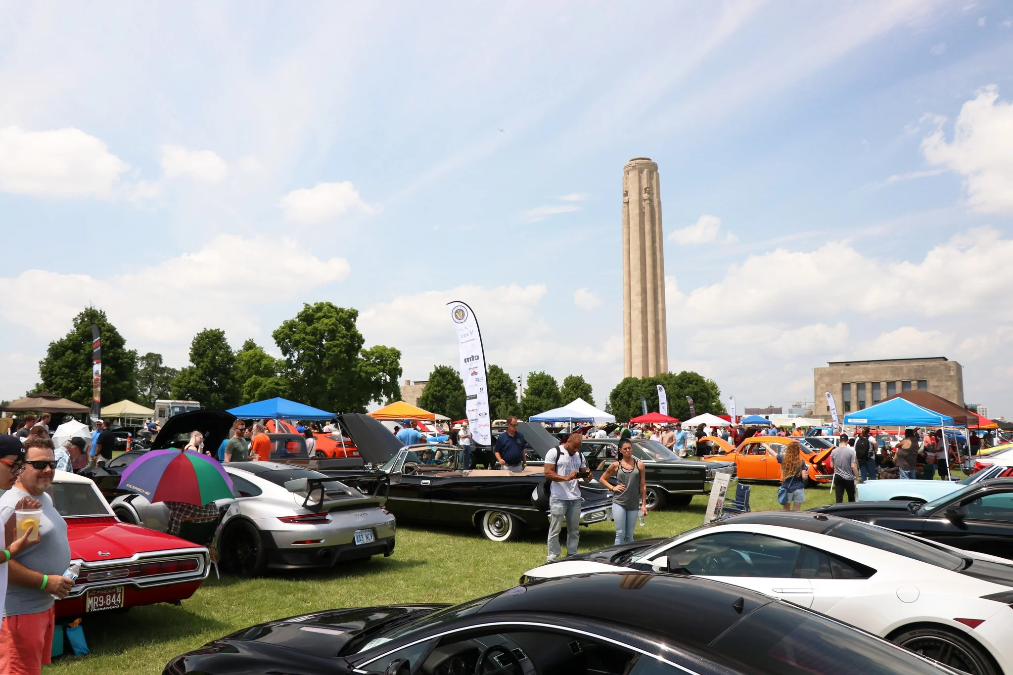 Classic car show with vintage vehicles and enthusiastic crowd
