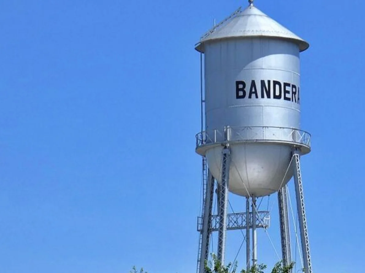 Water tower in Bandera against a clear blue sky