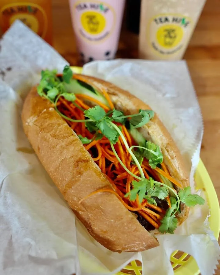 Vietnamese banh mi sandwich with fresh herbs and vegetables
