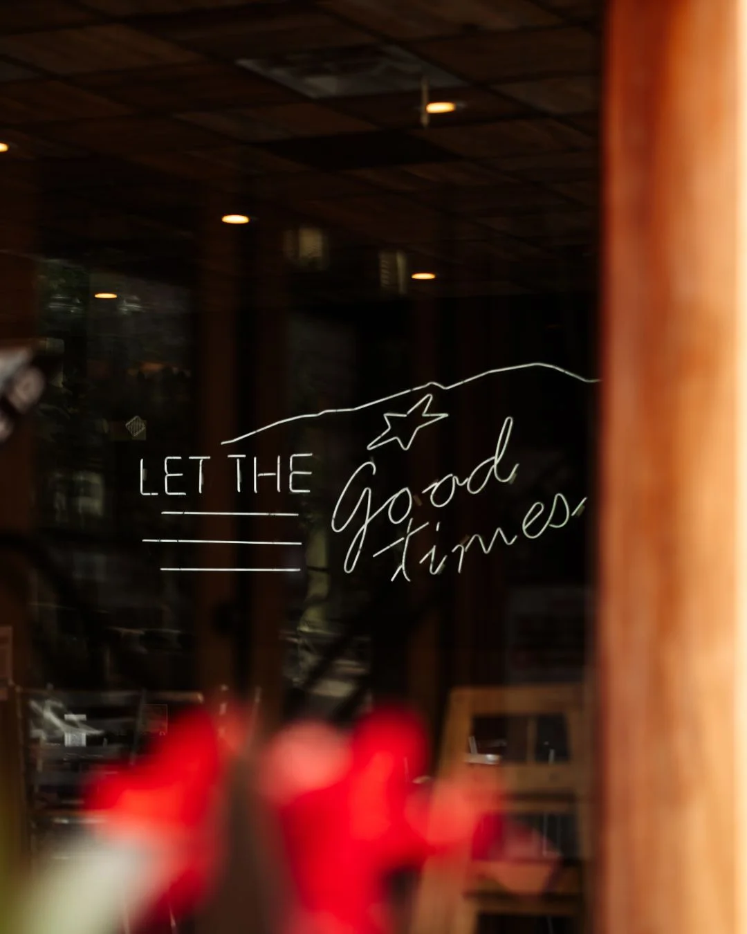 Cozy restaurant window with a welcoming message