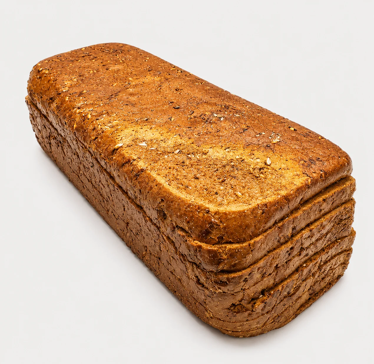 A loaf of brown bread with a textured surface, displayed on a white background.