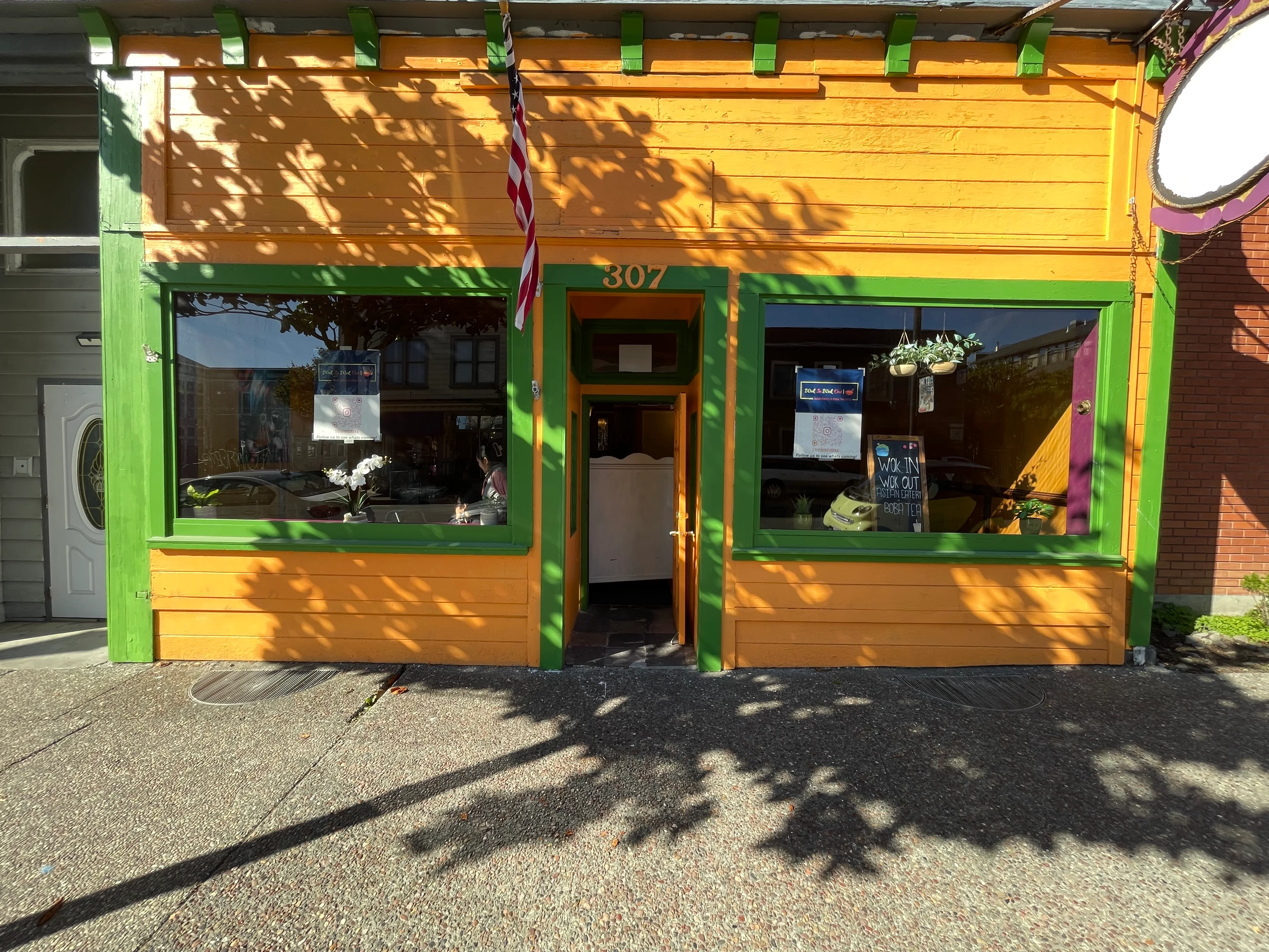 Colorful restaurant exterior with green and orange accents