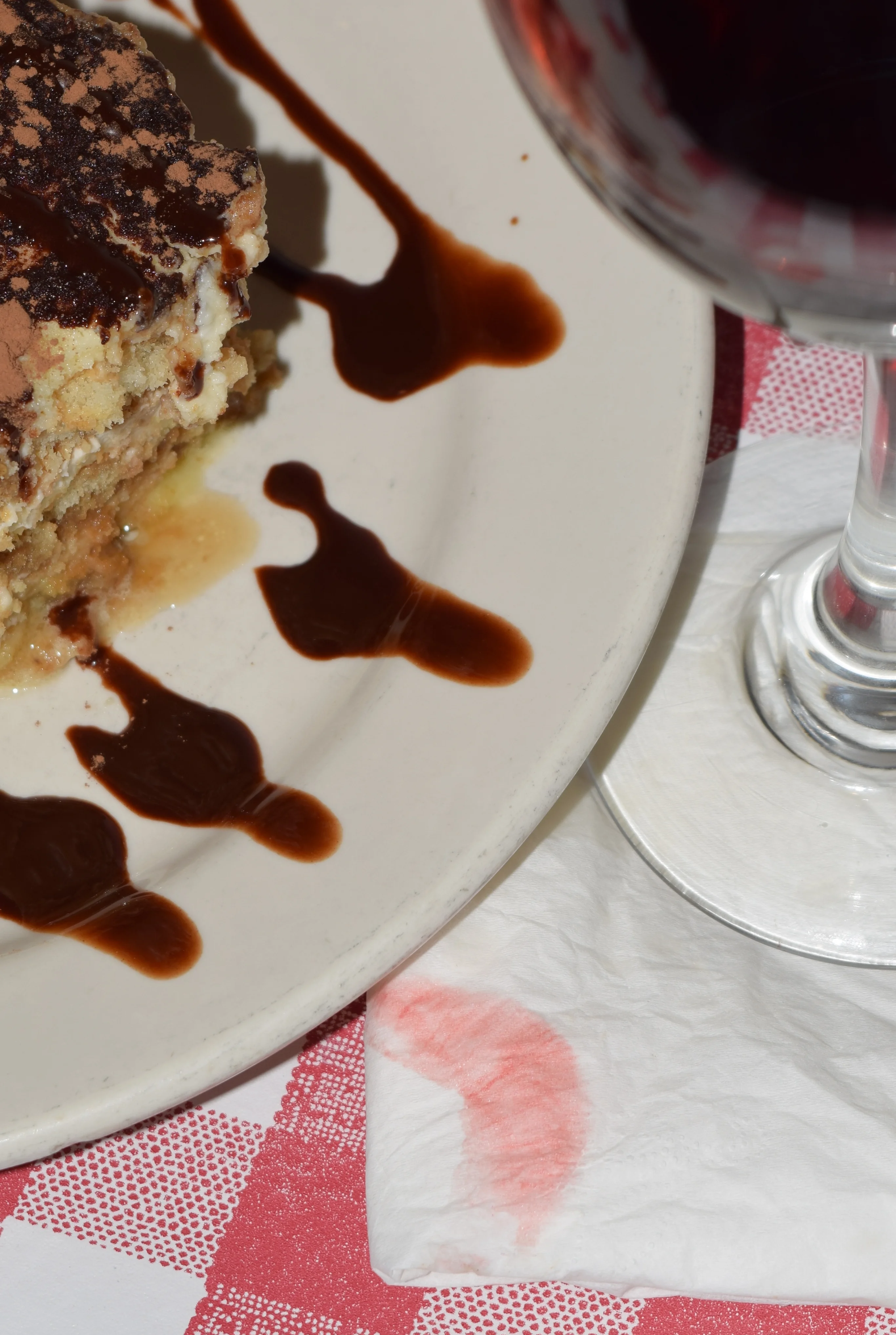 Delicious tiramisu dessert with red wine