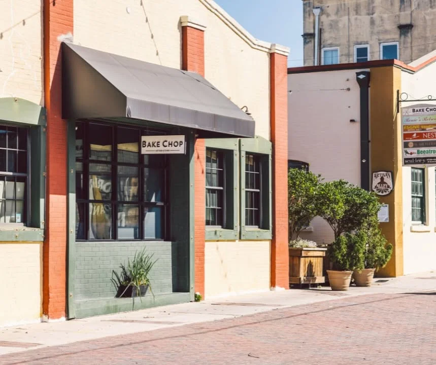 Charming restaurant exterior with a sign for Bake Chop