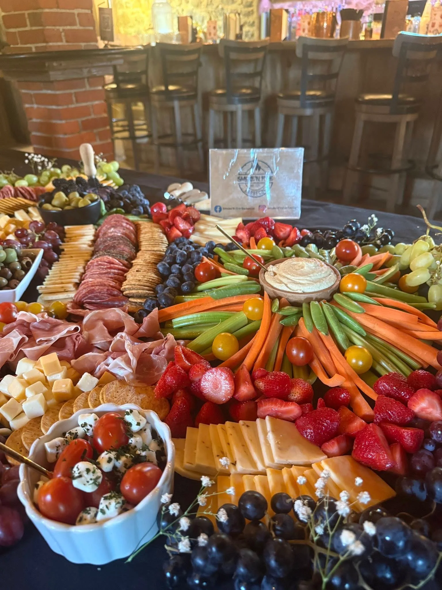 Artisan charcuterie board with assorted meats and fresh fruits