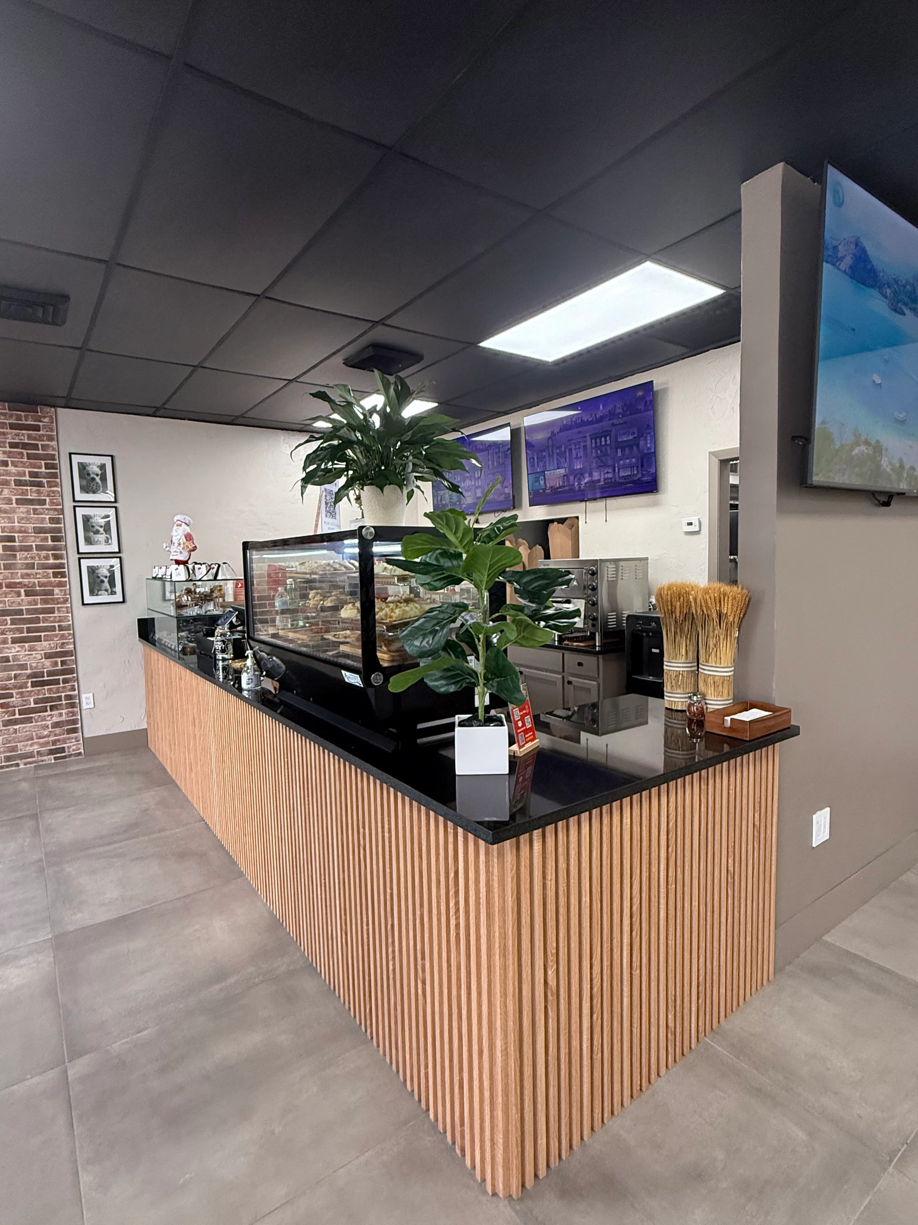 Modern restaurant counter with wood accents and display case