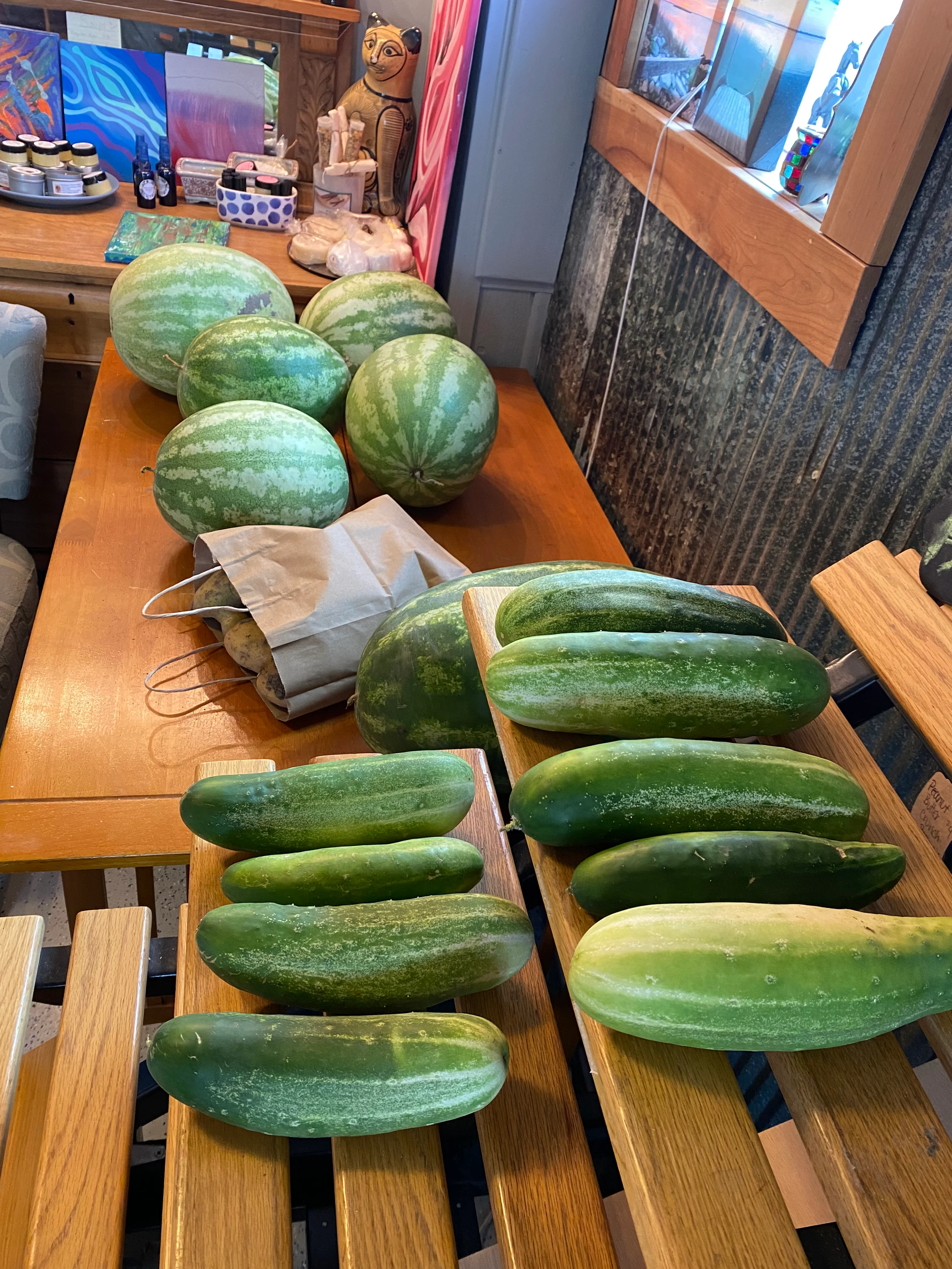 Fresh cucumbers and watermelons on a wooden table