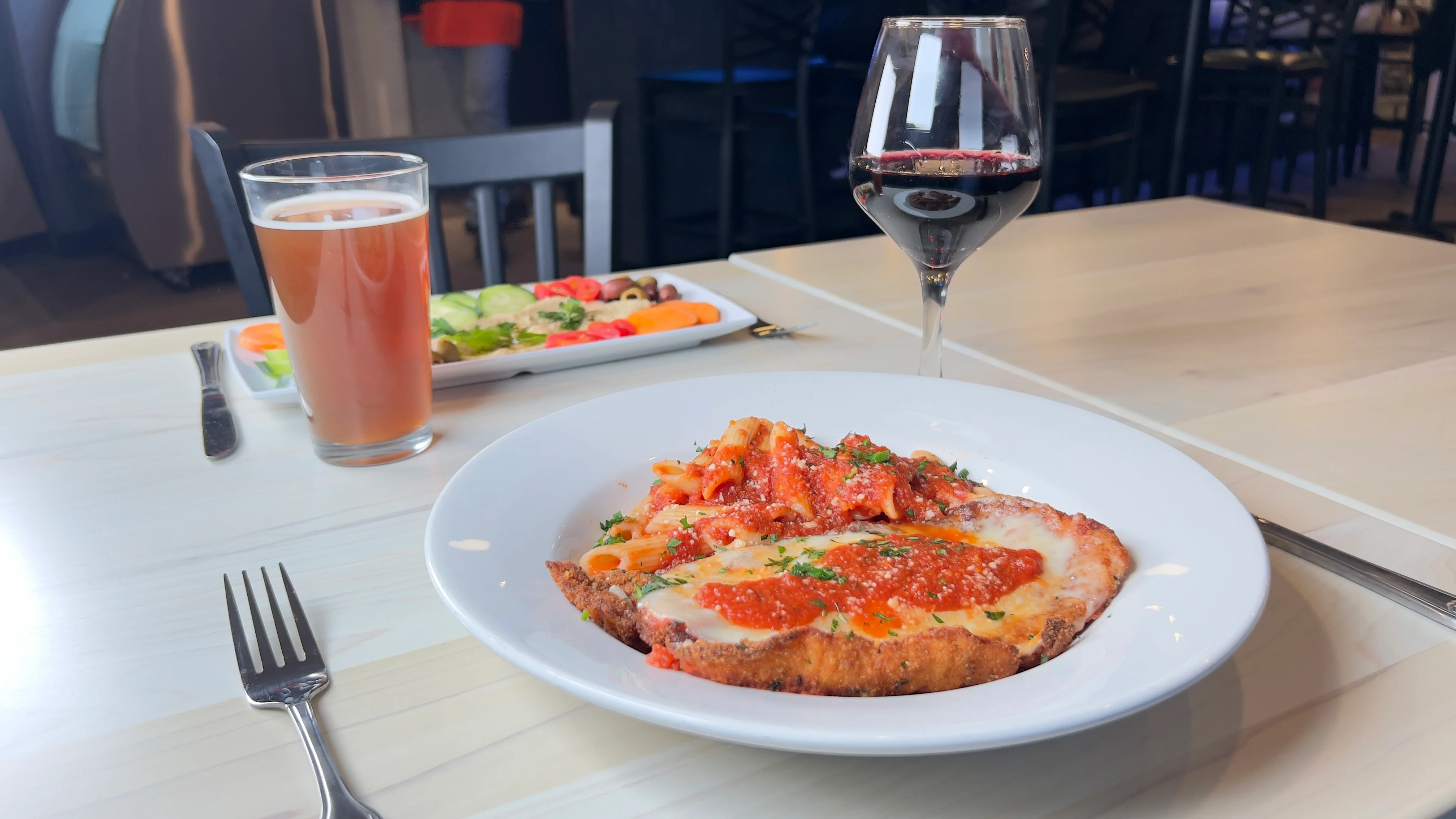 Italian chicken parmesan with pasta and salad