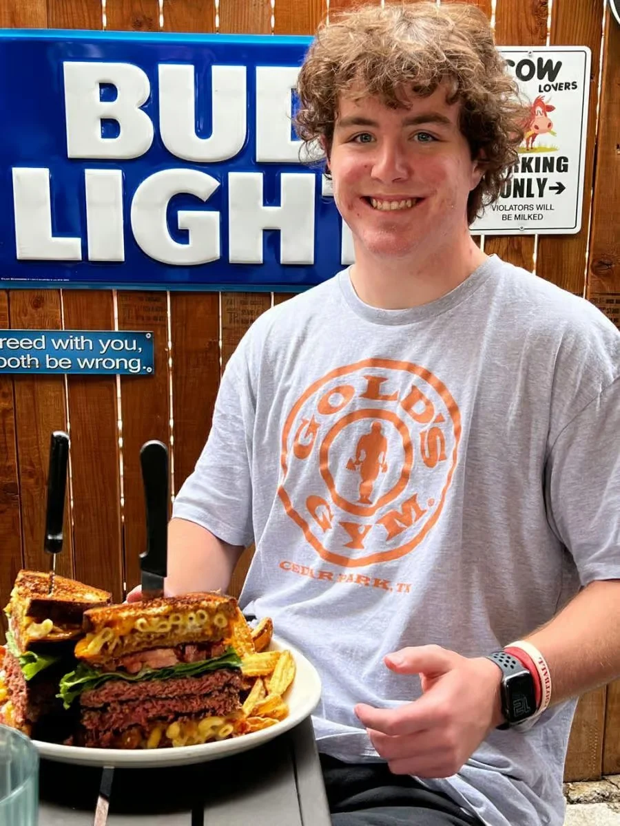 Massive American cheeseburger stack with fries